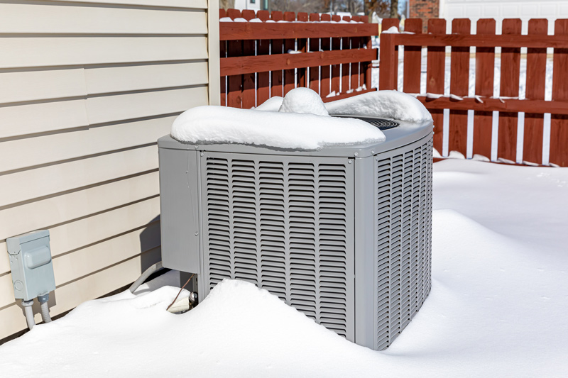 HVAC unit outside in the snow.