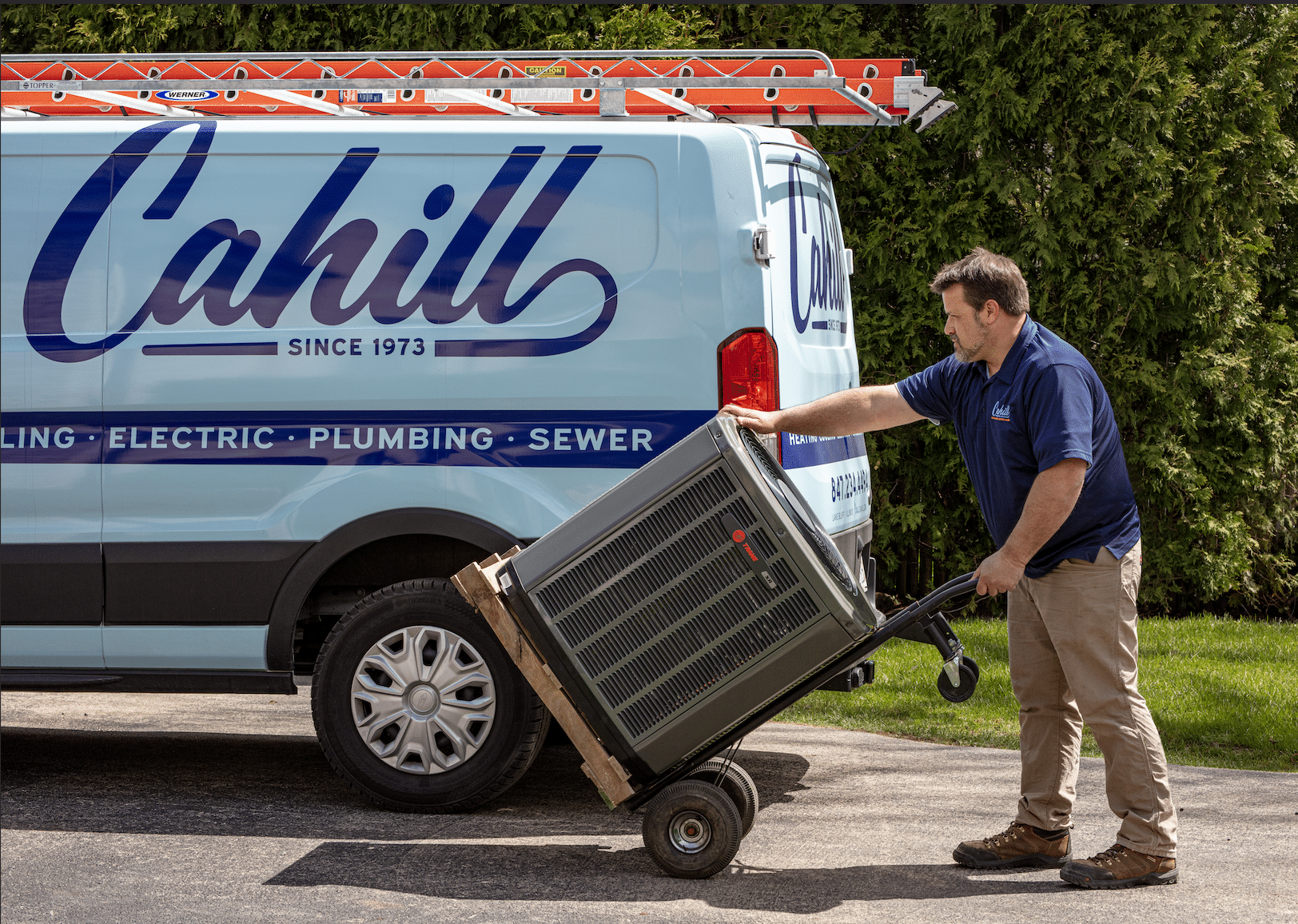 Cahill Heating and Air Conditioning team performing an air conditioning installation at a residential property.