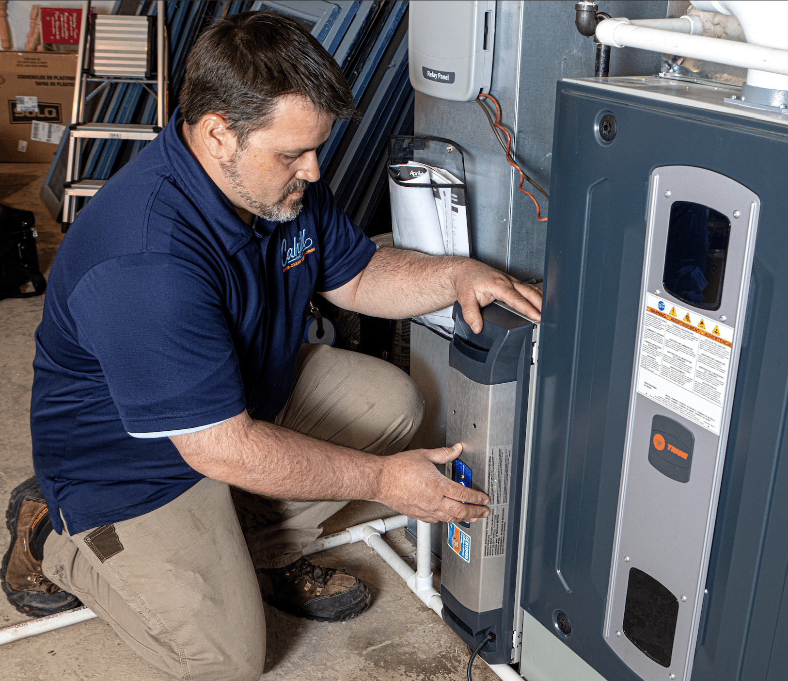 expert hvac technician is engaged in fixing a furnace